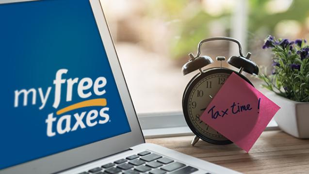 Picture of a computer and a clock that says, Tax Time.