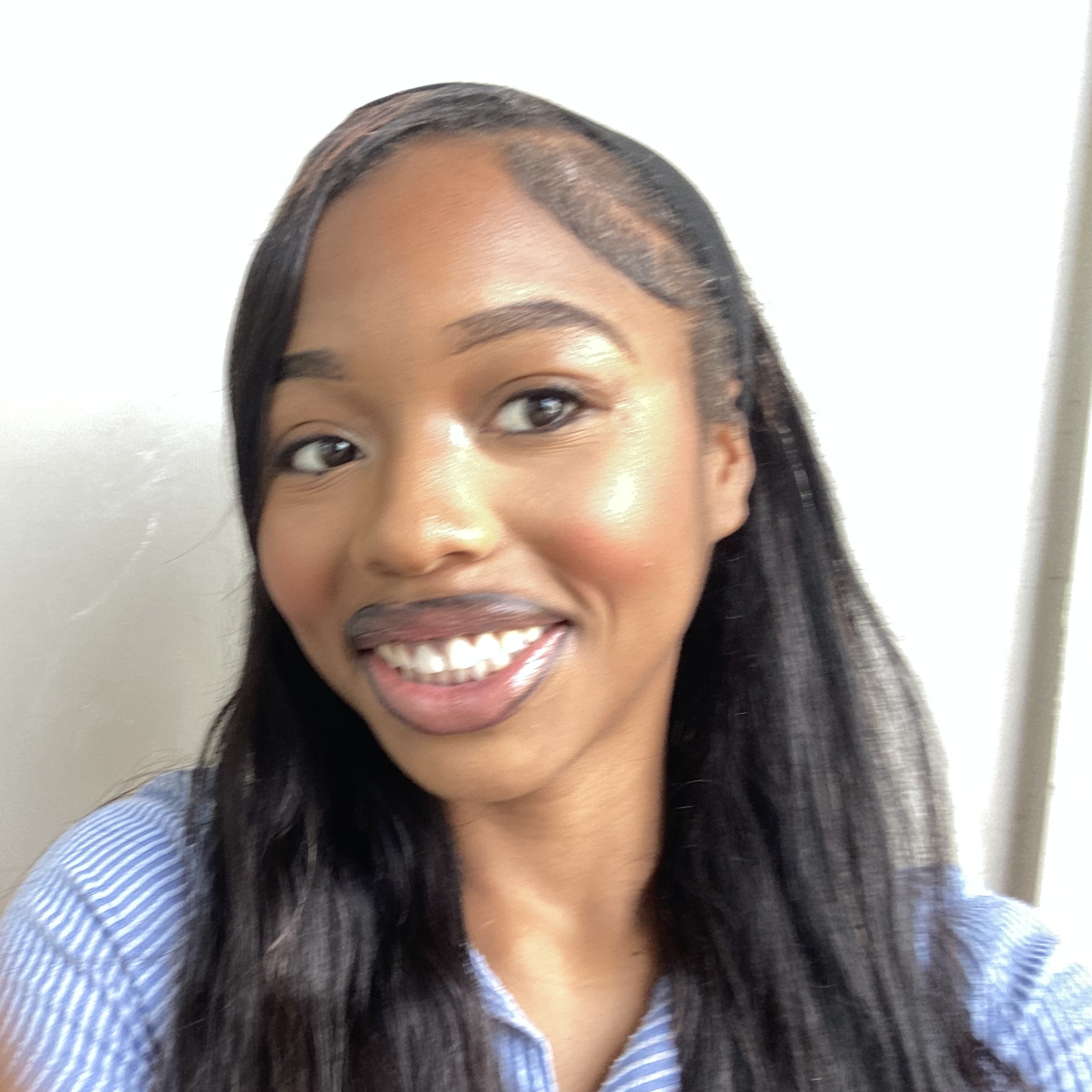A woman smiling at the camera.