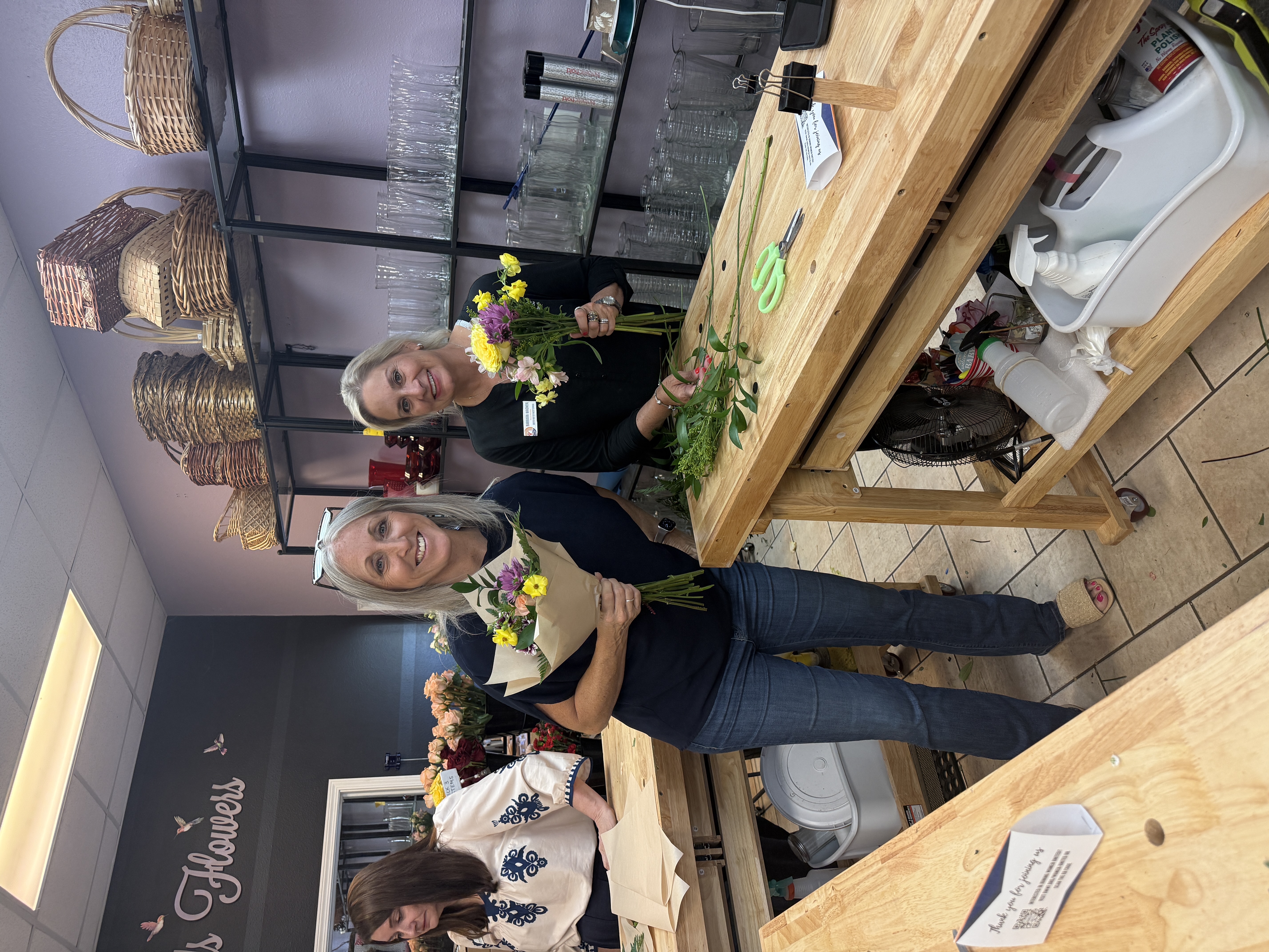 2 women holding their crafted Bouquets
