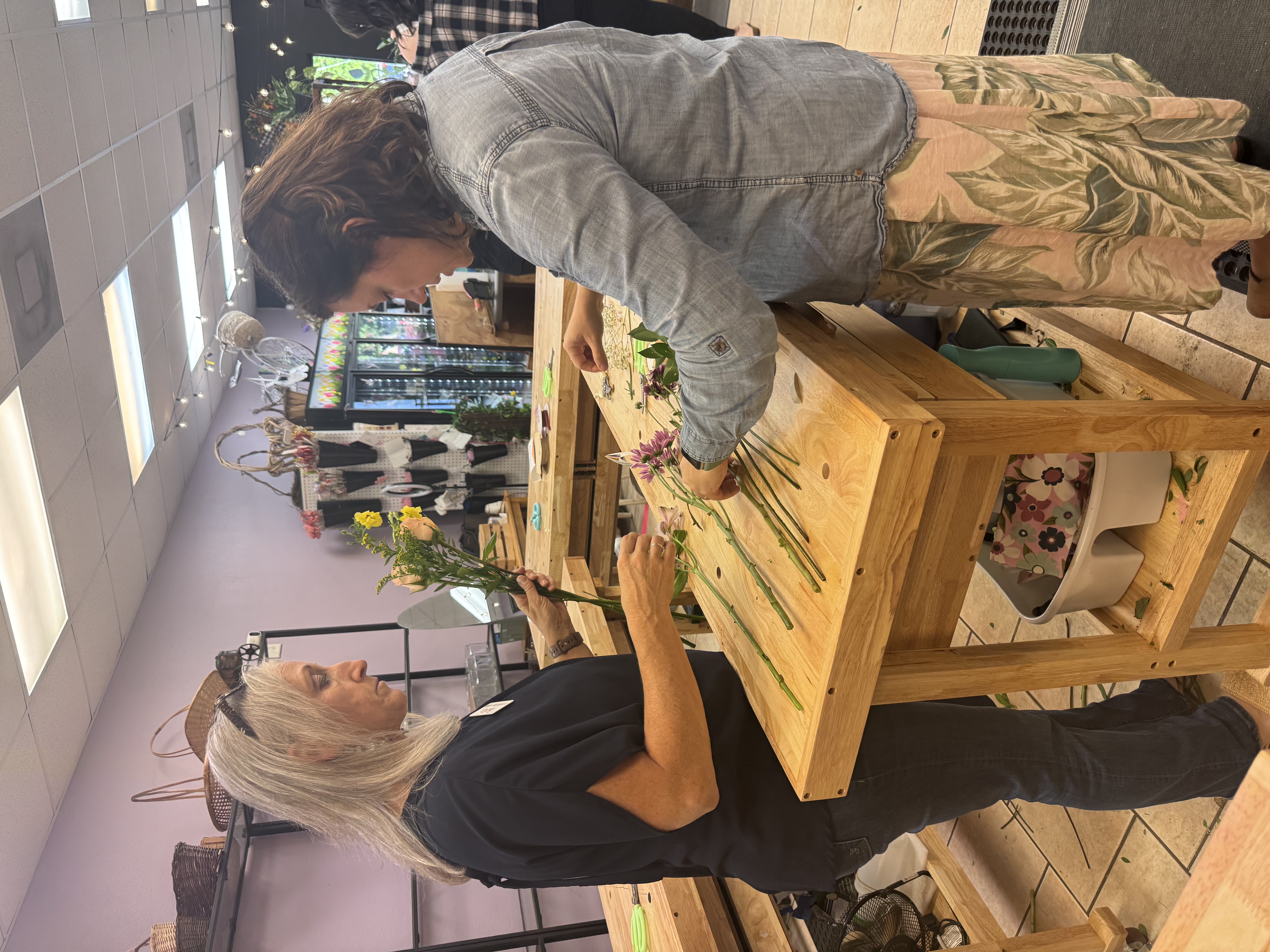 Women making flower bouquets