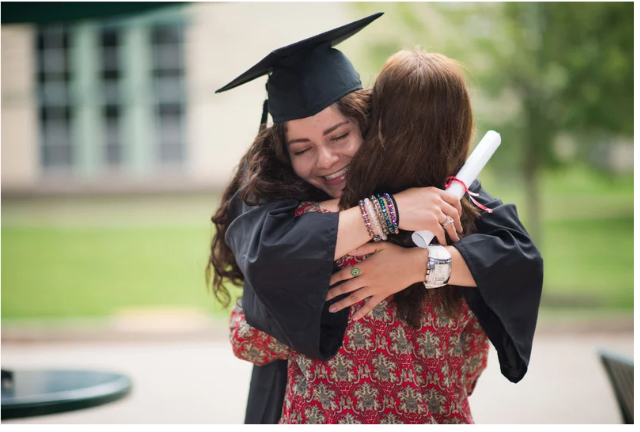 child celebrating graduating