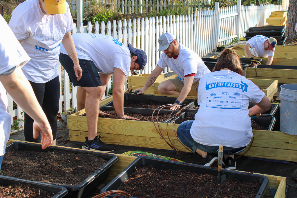 Volunteers work on planter