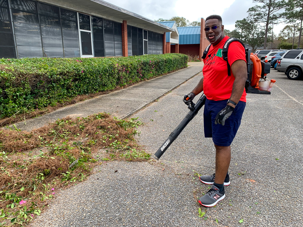 Volunteer uses blower