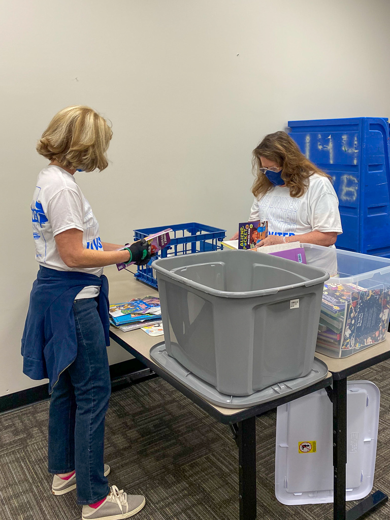 Volunteers sort books