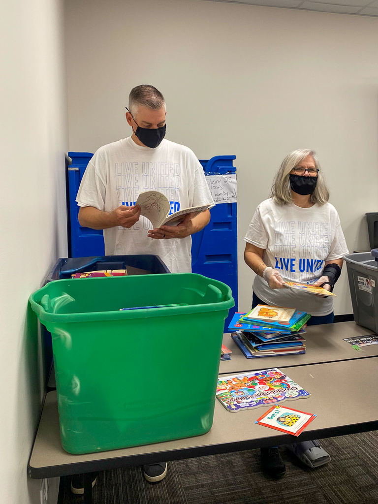 Volunteers sort books