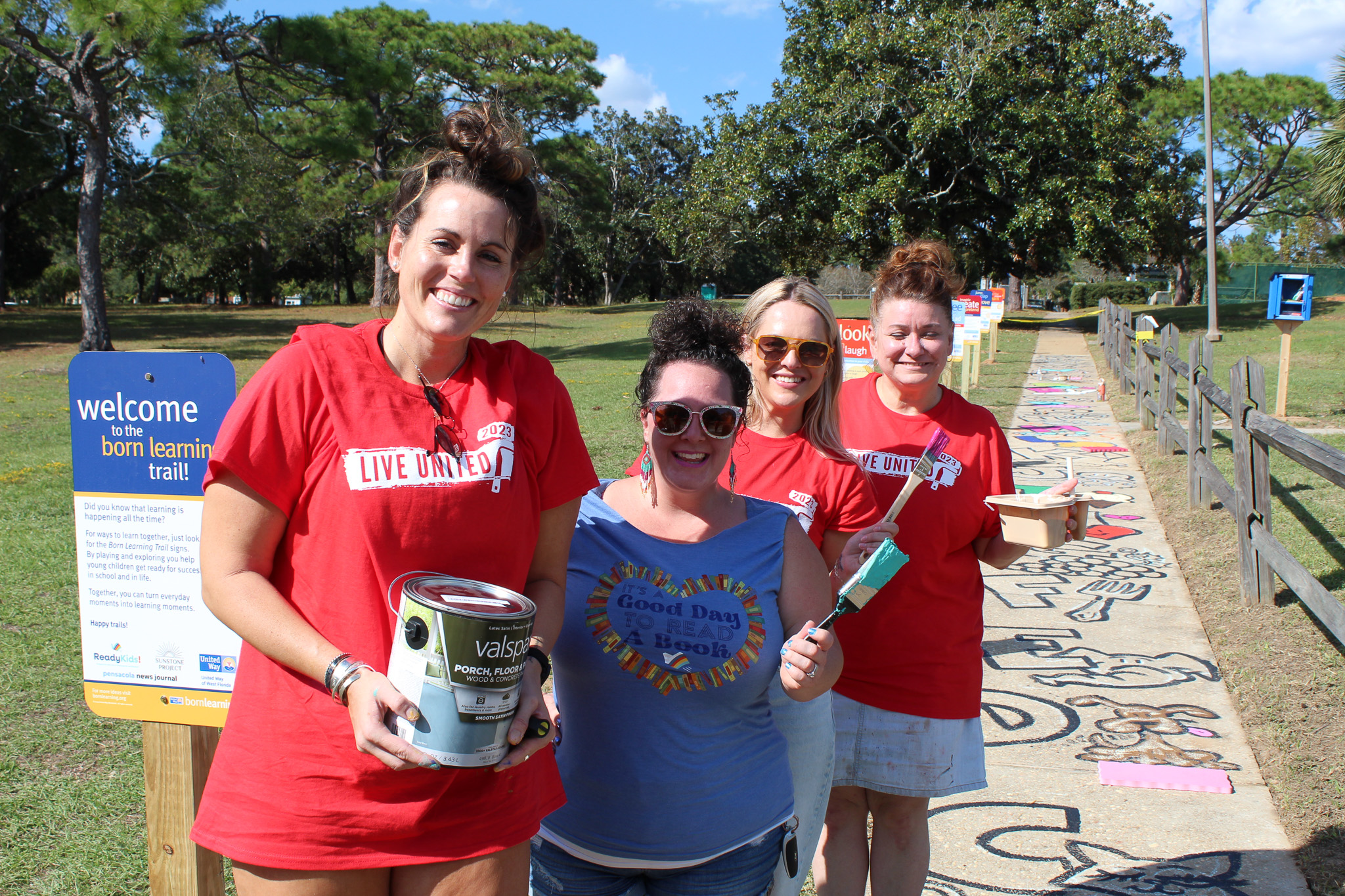 Pensacola News Journal volunteers at Born Learning Trail with ReadyKids!