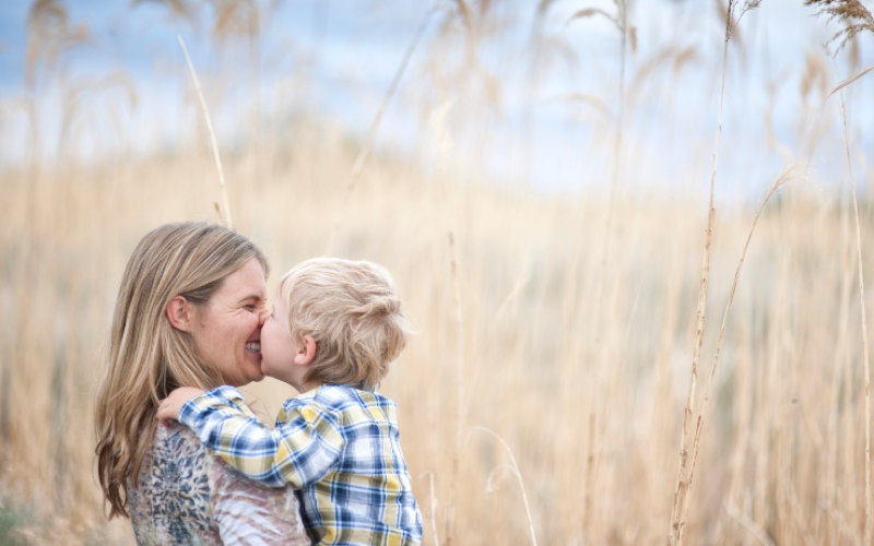 mother with son in wheat field