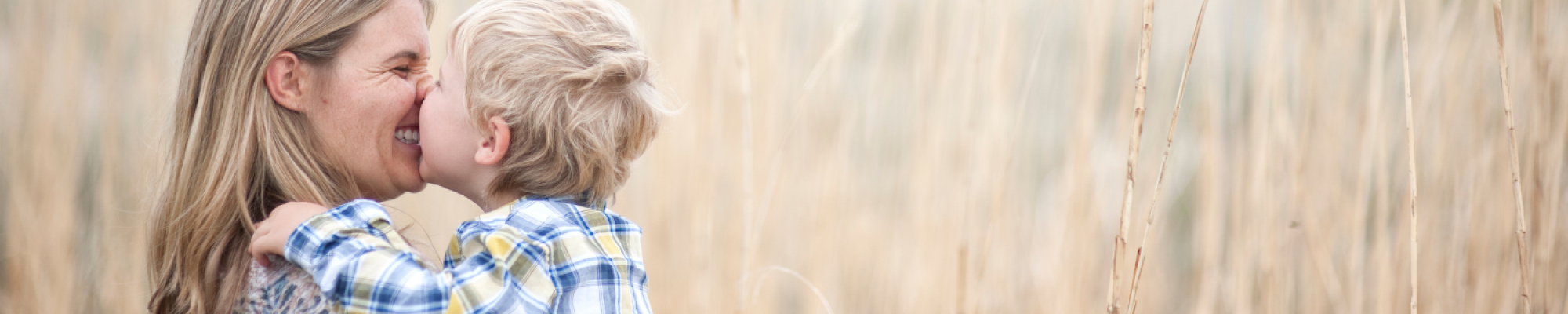 mother with son in wheat field