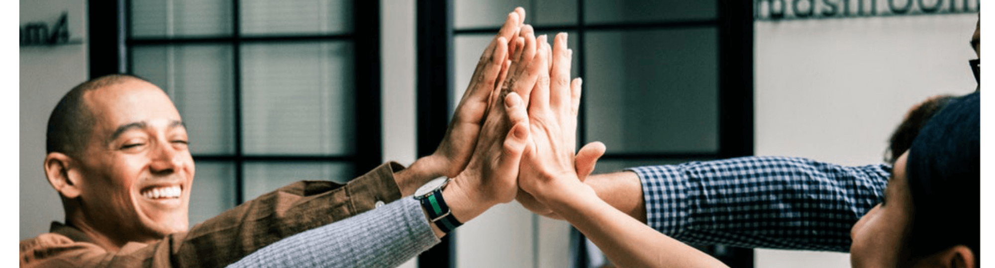 Group of people high-fiving.