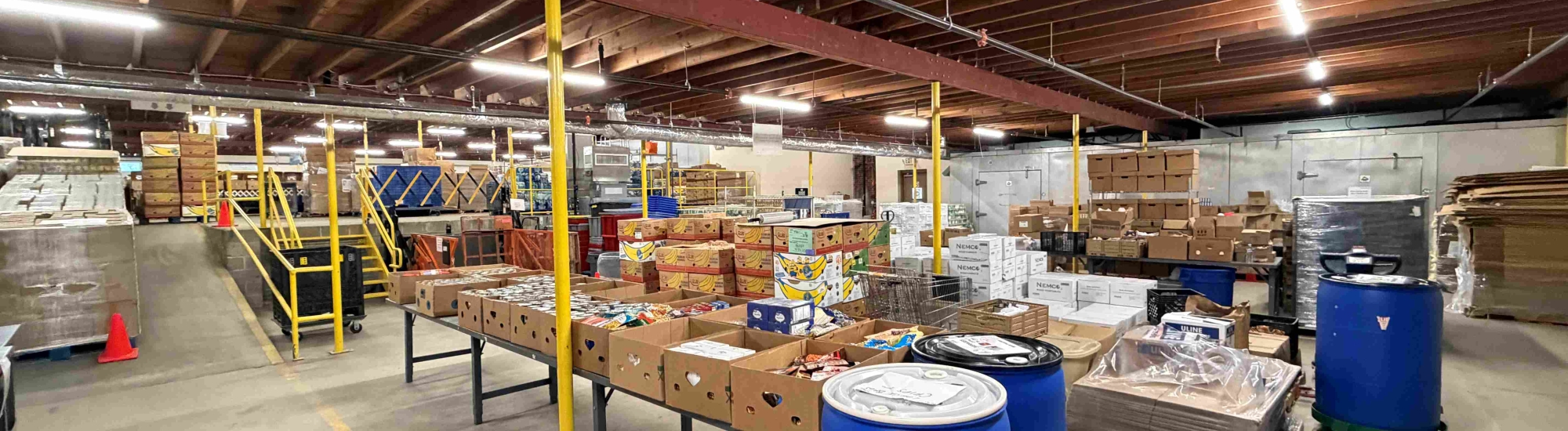 Inside a warehouse with boxes of food.