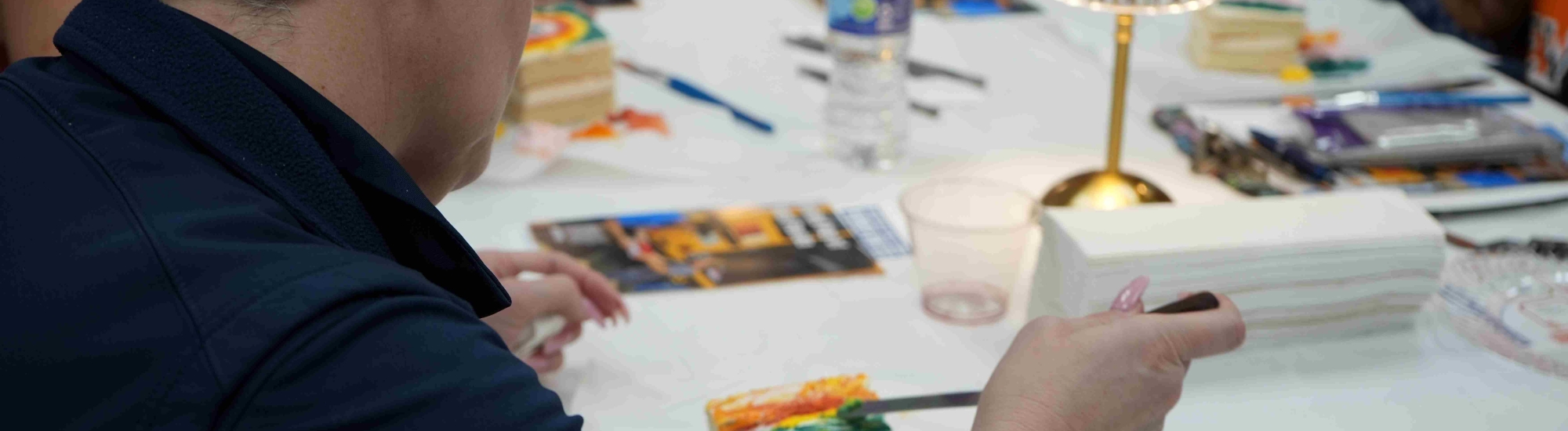 Woman painting a piece of cake