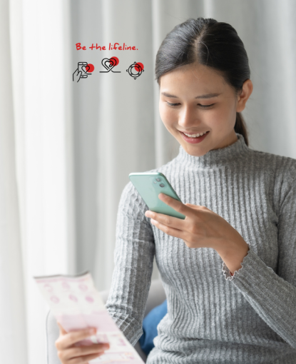 A girl is on her phone, scanning a QR code and smiling. Text says, "Be the Lifeline." 