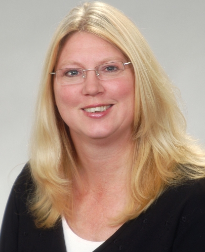 Woman smiling at the camera.