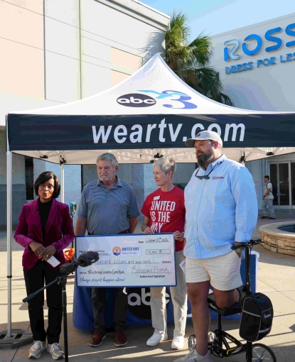 Renasant Bank and Guy Brothers Roofing presenting a check to United Way of West Florida. 
